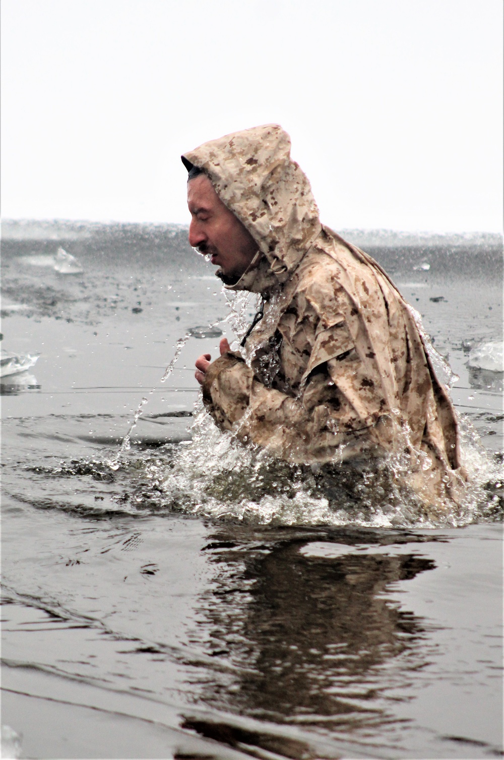 6th Marine Regiment troops jump in for cold-water immersion training at Fort McCoy