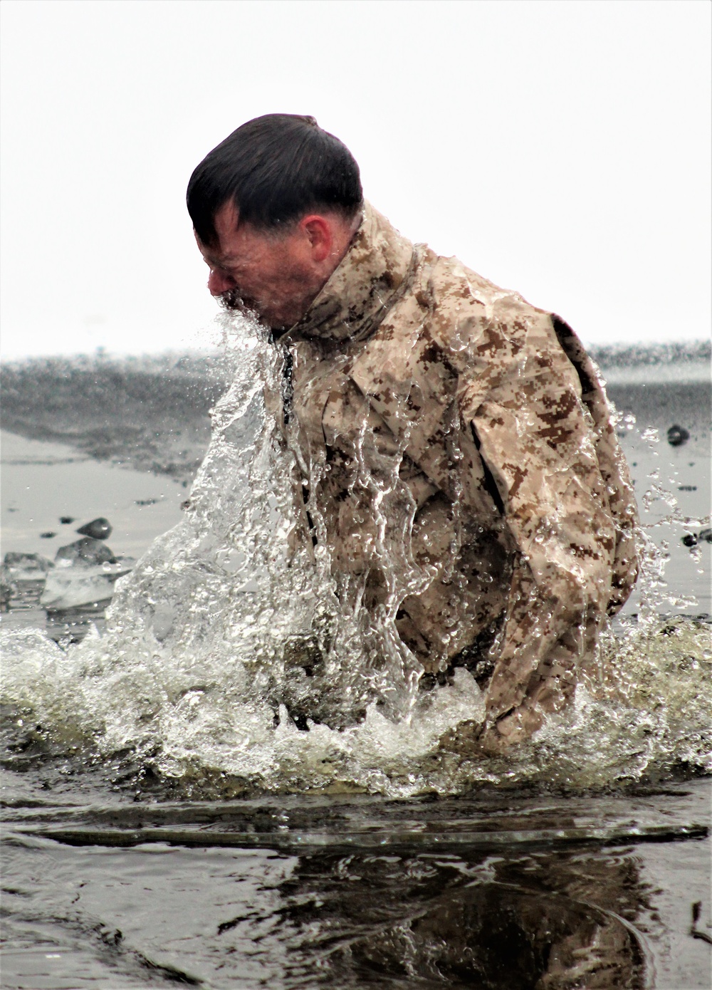 6th Marine Regiment troops jump in for cold-water immersion training at Fort McCoy