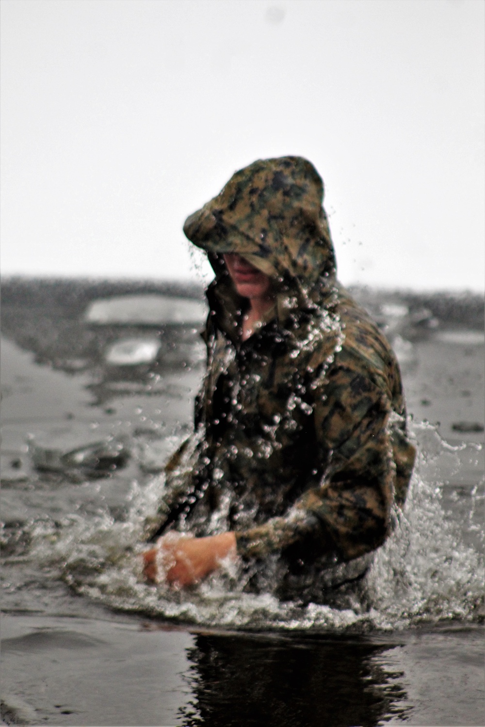 6th Marine Regiment troops jump in for cold-water immersion training at Fort McCoy