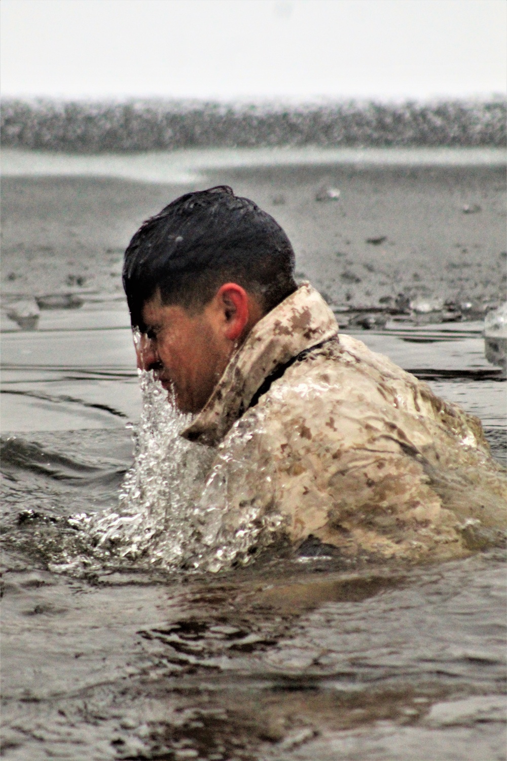 6th Marine Regiment troops jump in for cold-water immersion training at Fort McCoy