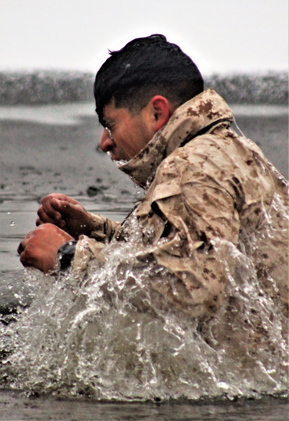 6th Marine Regiment troops jump in for cold-water immersion training at Fort McCoy