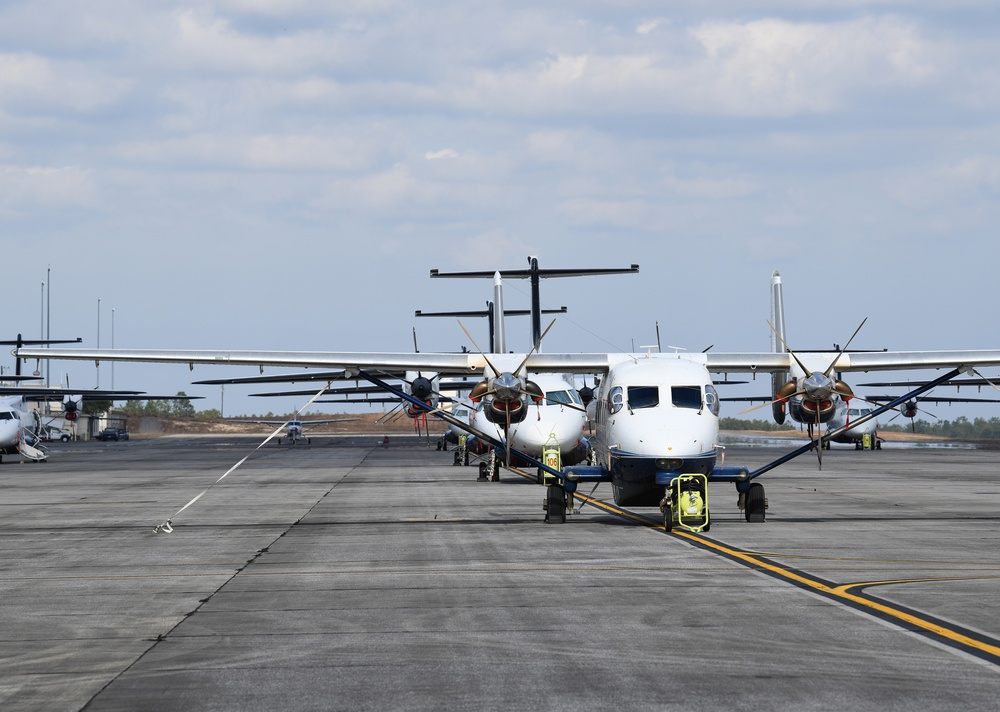 C-146 Wolfhounds and a C-145A Combat Coyote line a runway