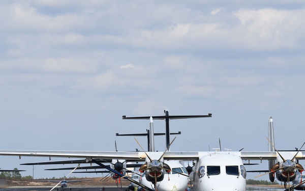 C-146 Wolfhounds and a C-145A Combat Coyote line a runway