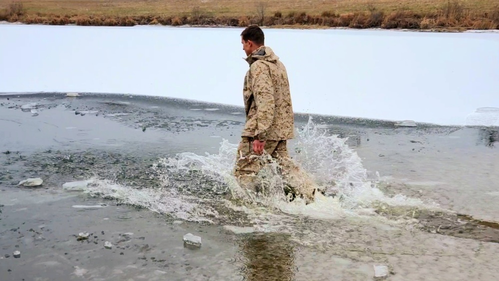 6th Marine Regiment troops jump in for cold-water immersion training at Fort McCoy