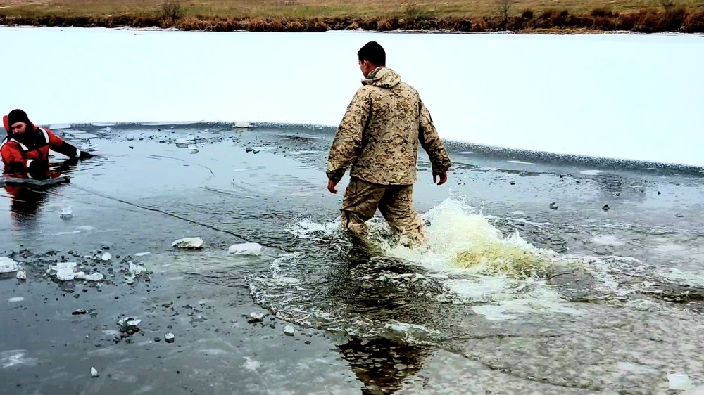 6th Marine Regiment troops jump in for cold-water immersion training at Fort McCoy