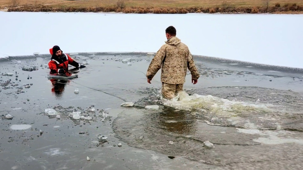 6th Marine Regiment troops jump in for cold-water immersion training at Fort McCoy