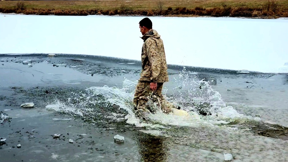 6th Marine Regiment troops jump in for cold-water immersion training at Fort McCoy