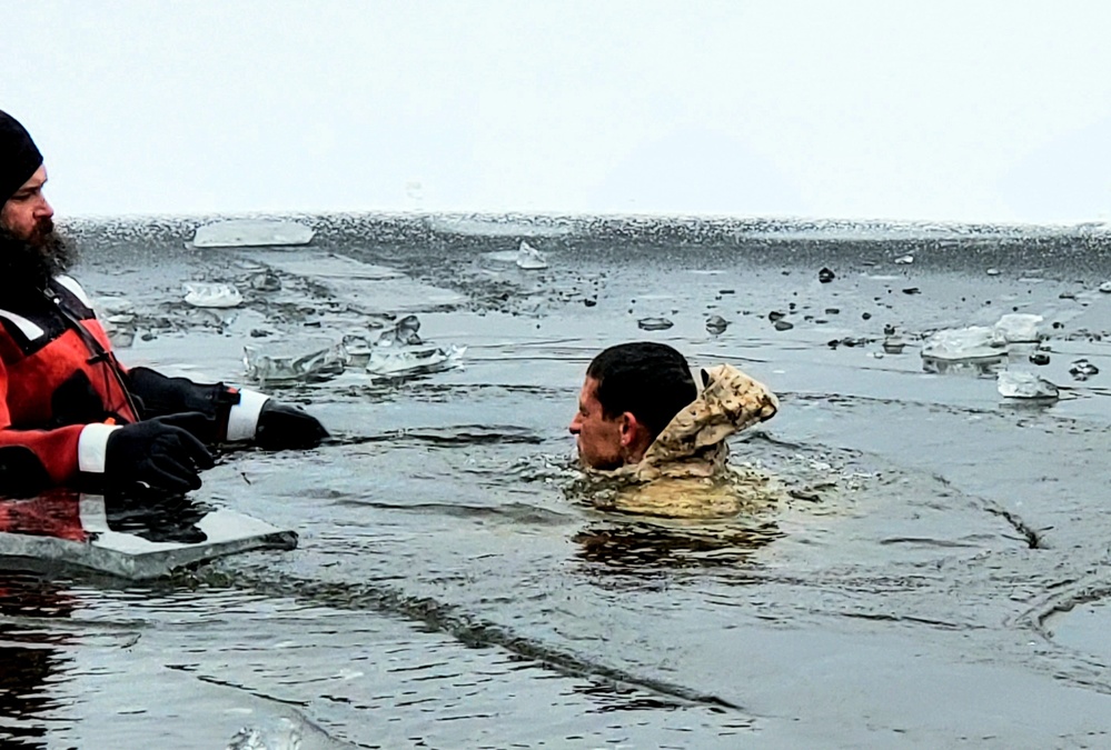 6th Marine Regiment troops jump in for cold-water immersion training at Fort McCoy