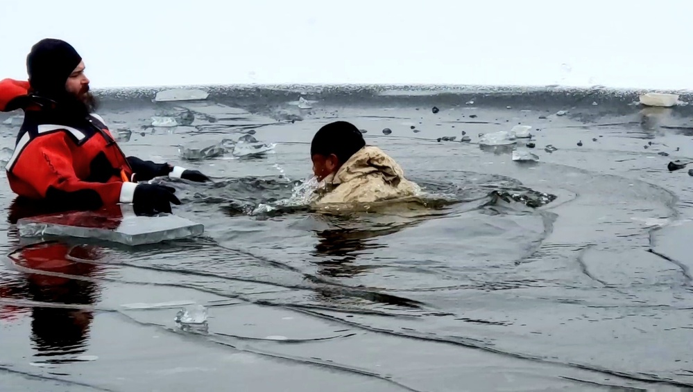 6th Marine Regiment troops jump in for cold-water immersion training at Fort McCoy