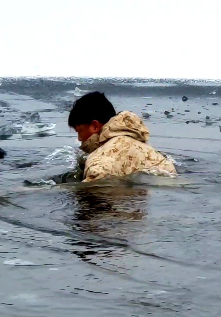 6th Marine Regiment troops jump in for cold-water immersion training at Fort McCoy