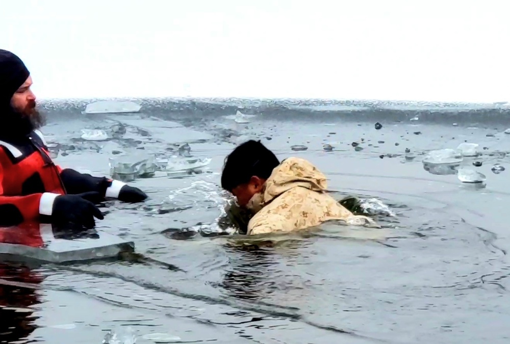 6th Marine Regiment troops jump in for cold-water immersion training at Fort McCoy