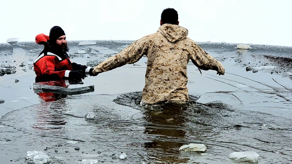 6th Marine Regiment troops jump in for cold-water immersion training at Fort McCoy