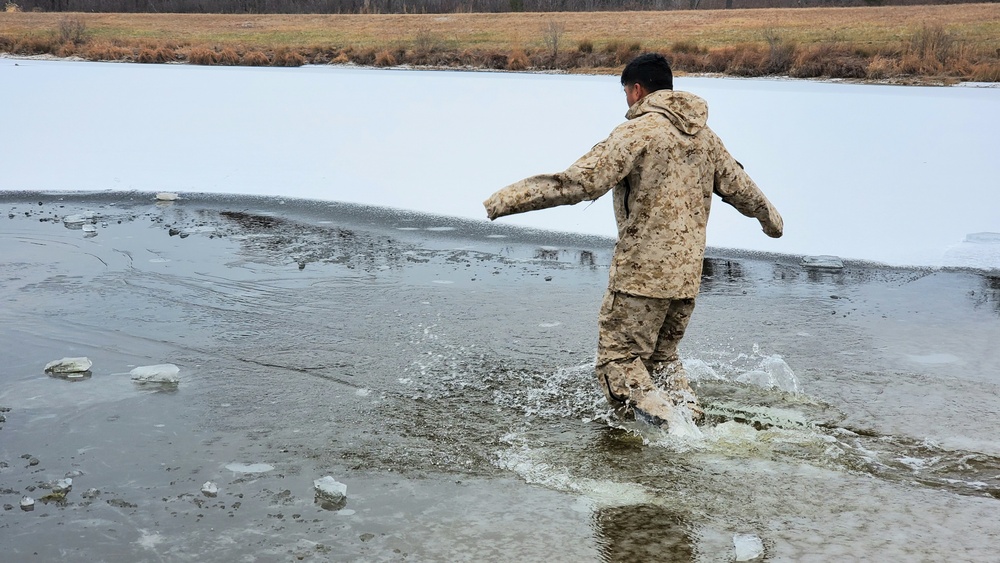 6th Marine Regiment troops jump in for cold-water immersion training at Fort McCoy