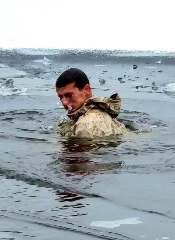 6th Marine Regiment troops jump in for cold-water immersion training at Fort McCoy