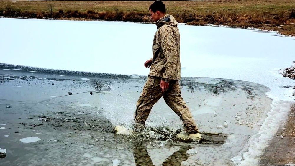6th Marine Regiment troops jump in for cold-water immersion training at Fort McCoy