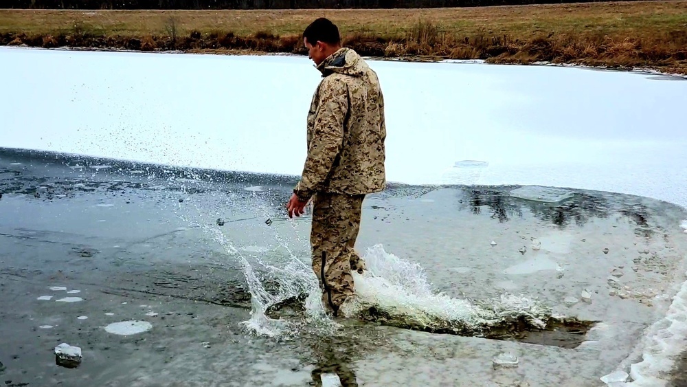 6th Marine Regiment troops jump in for cold-water immersion training at Fort McCoy