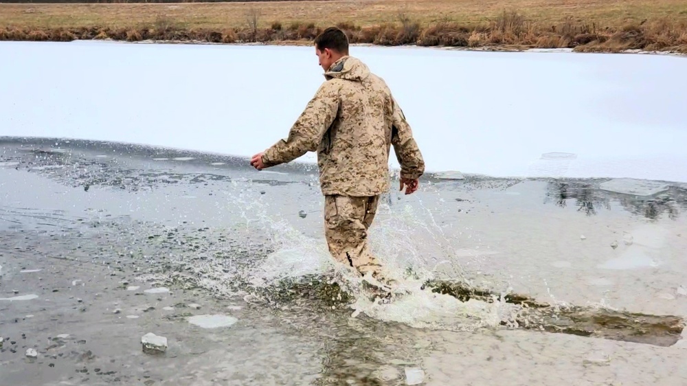 6th Marine Regiment troops jump in for cold-water immersion training at Fort McCoy