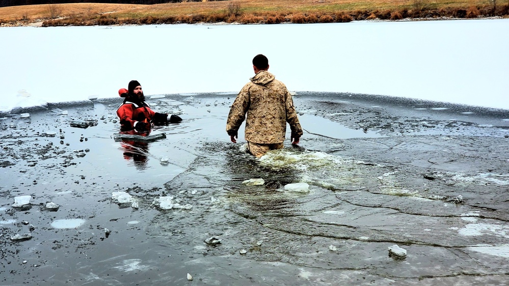 6th Marine Regiment troops jump in for cold-water immersion training at Fort McCoy