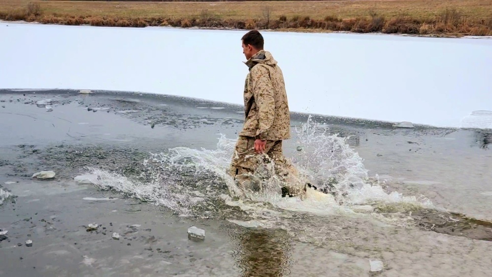 6th Marine Regiment troops jump in for cold-water immersion training at Fort McCoy