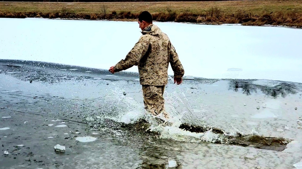 6th Marine Regiment troops jump in for cold-water immersion training at Fort McCoy
