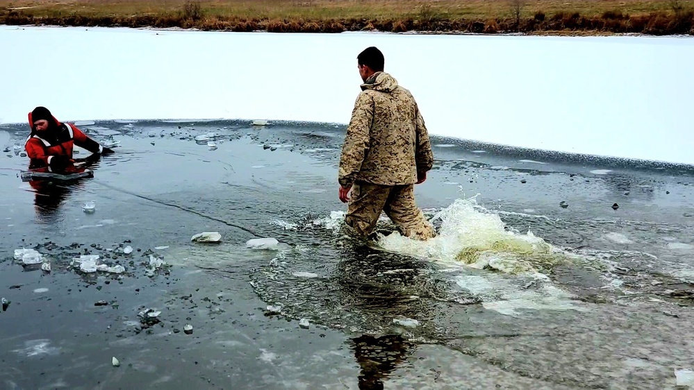 6th Marine Regiment troops jump in for cold-water immersion training at Fort McCoy