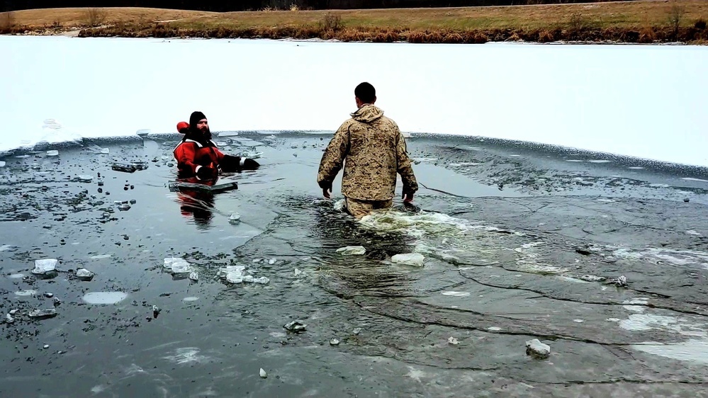 6th Marine Regiment troops jump in for cold-water immersion training at Fort McCoy