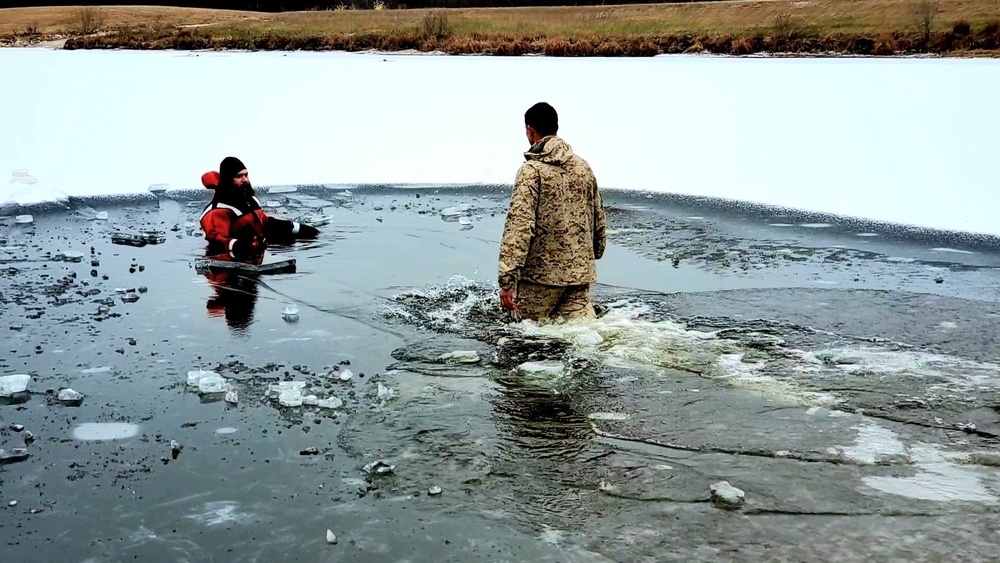 6th Marine Regiment troops jump in for cold-water immersion training at Fort McCoy