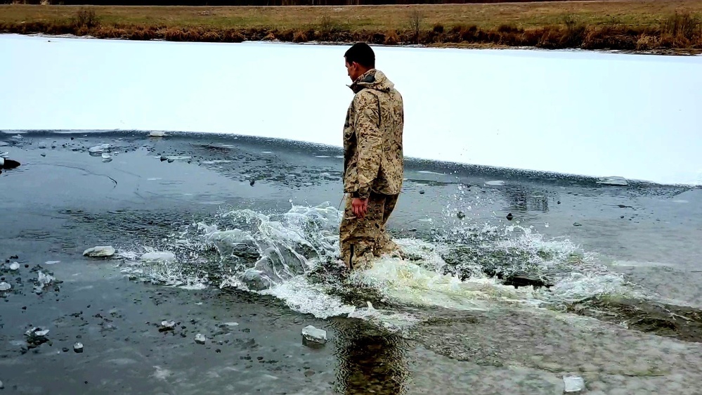 6th Marine Regiment troops jump in for cold-water immersion training at Fort McCoy