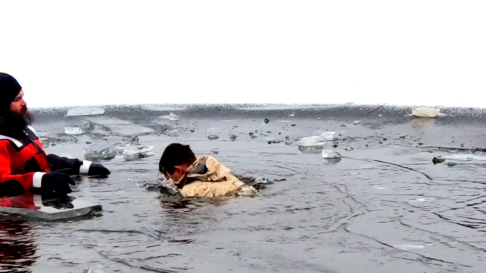 6th Marine Regiment troops jump in for cold-water immersion training at Fort McCoy