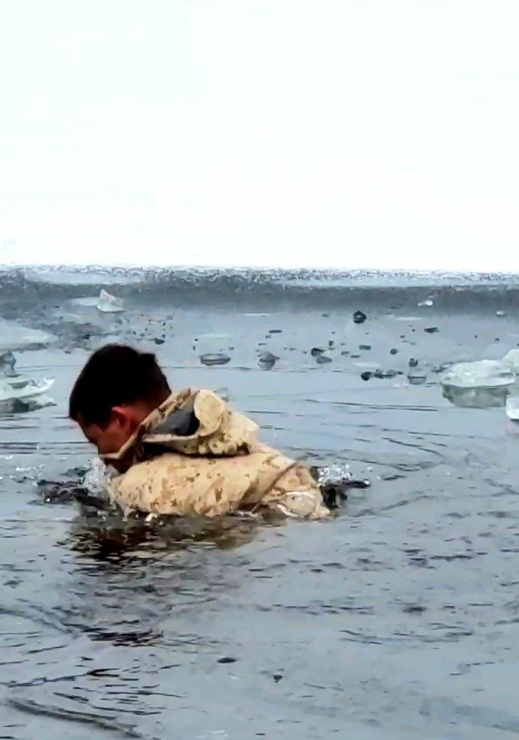 6th Marine Regiment troops jump in for cold-water immersion training at Fort McCoy
