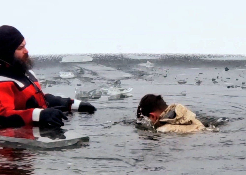 6th Marine Regiment troops jump in for cold-water immersion training at Fort McCoy