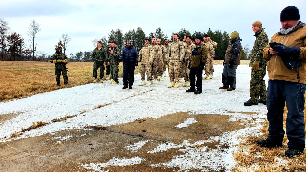 6th Marine Regiment troops jump in for cold-water immersion training at Fort McCoy