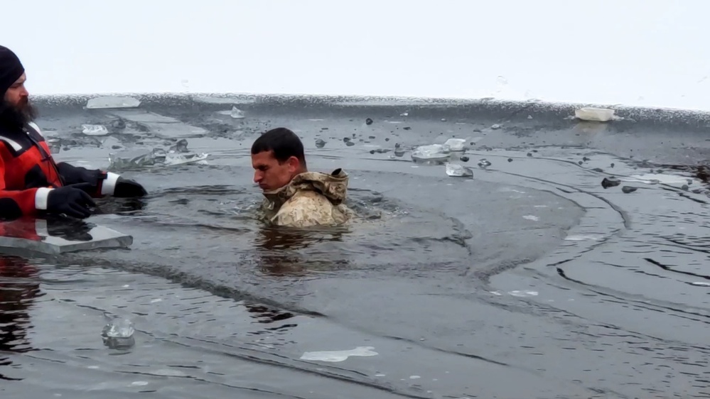 6th Marine Regiment troops jump in for cold-water immersion training at Fort McCoy
