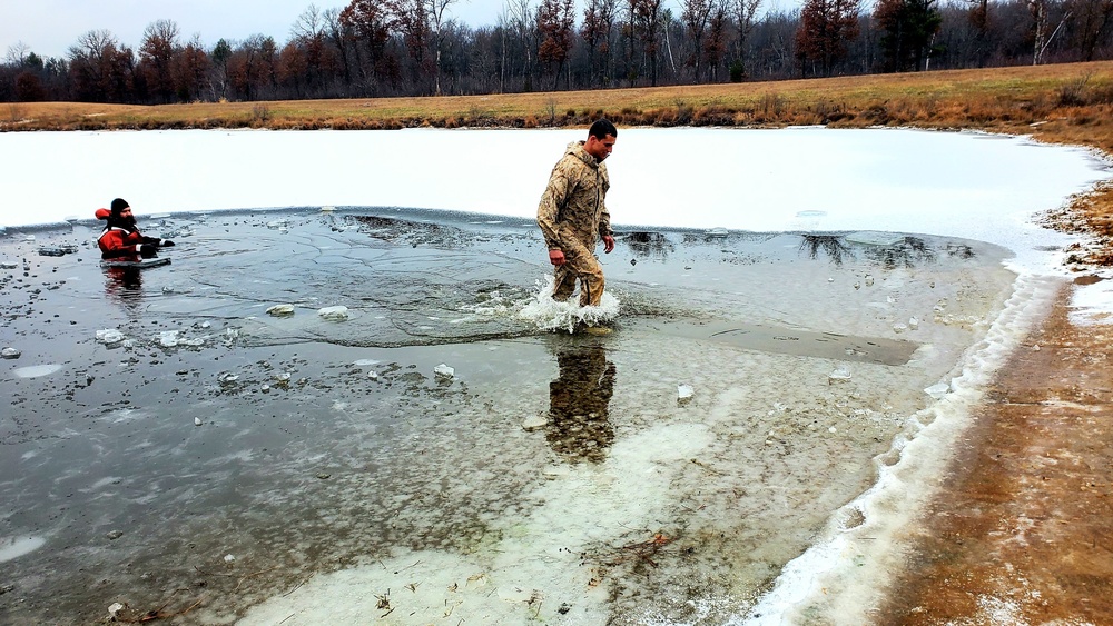 6th Marine Regiment troops jump in for cold-water immersion training at Fort McCoy