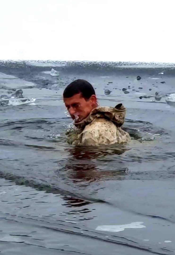 6th Marine Regiment troops jump in for cold-water immersion training at Fort McCoy