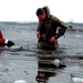 6th Marine Regiment troops jump in for cold-water immersion training at Fort McCoy