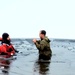 6th Marine Regiment troops jump in for cold-water immersion training at Fort McCoy