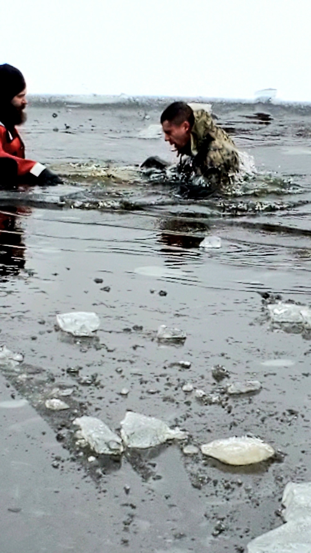 6th Marine Regiment troops jump in for cold-water immersion training at Fort McCoy