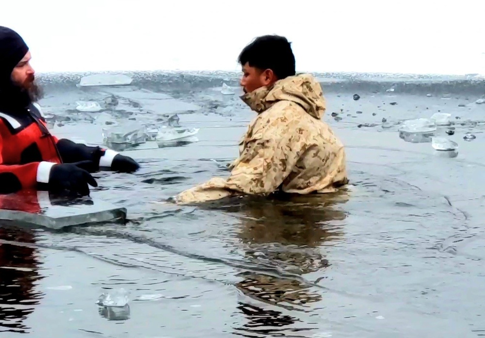 6th Marine Regiment troops jump in for cold-water immersion training at Fort McCoy