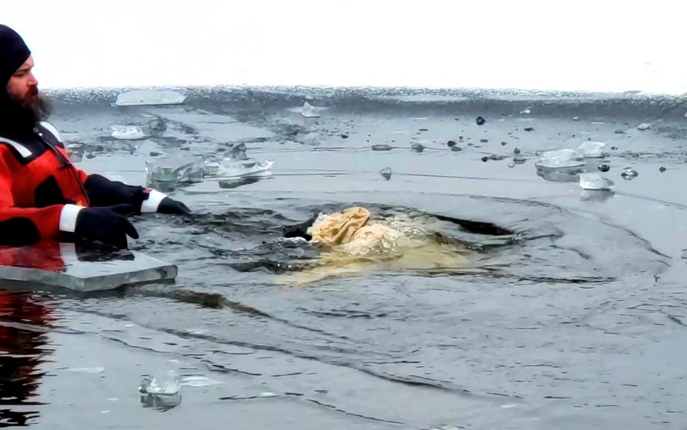 6th Marine Regiment troops jump in for cold-water immersion training at Fort McCoy