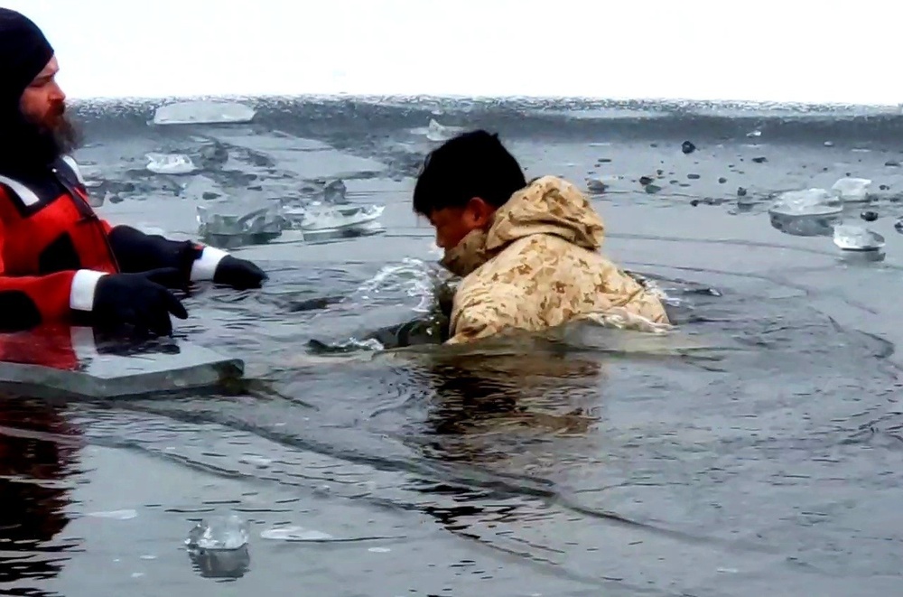 6th Marine Regiment troops jump in for cold-water immersion training at Fort McCoy