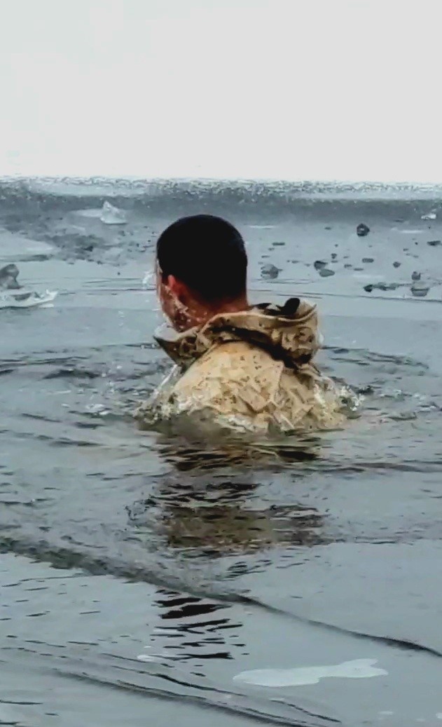 6th Marine Regiment troops jump in for cold-water immersion training at Fort McCoy