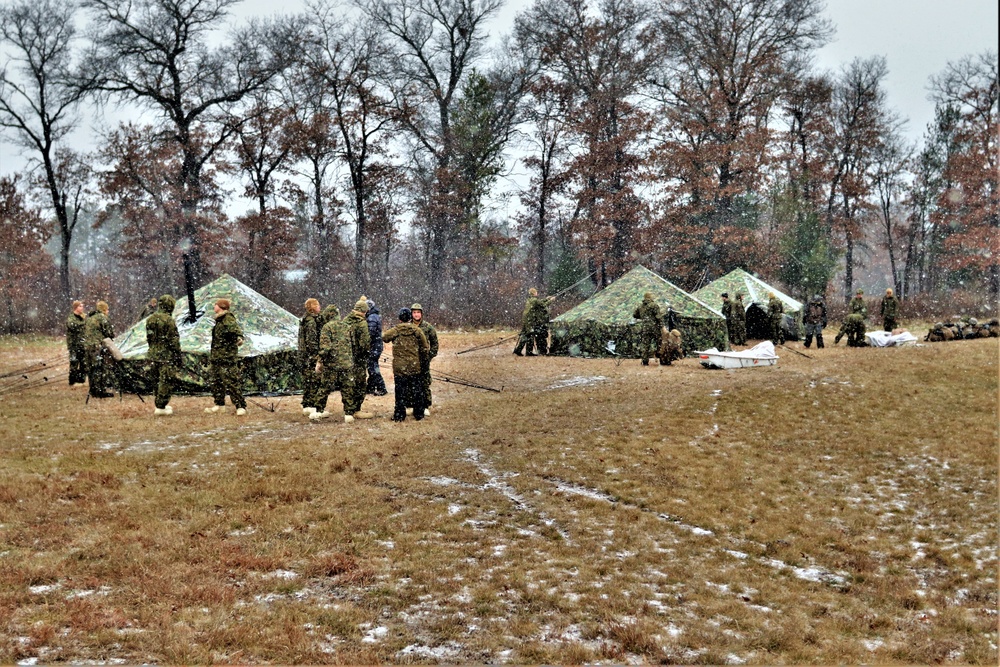 Marines practice tent building during Cold-Weather Operations Course training at Fort McCoy