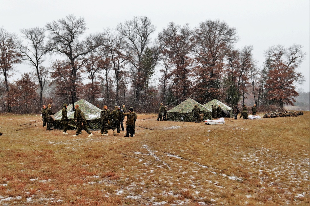 Marines practice tent building during Cold-Weather Operations Course training at Fort McCoy