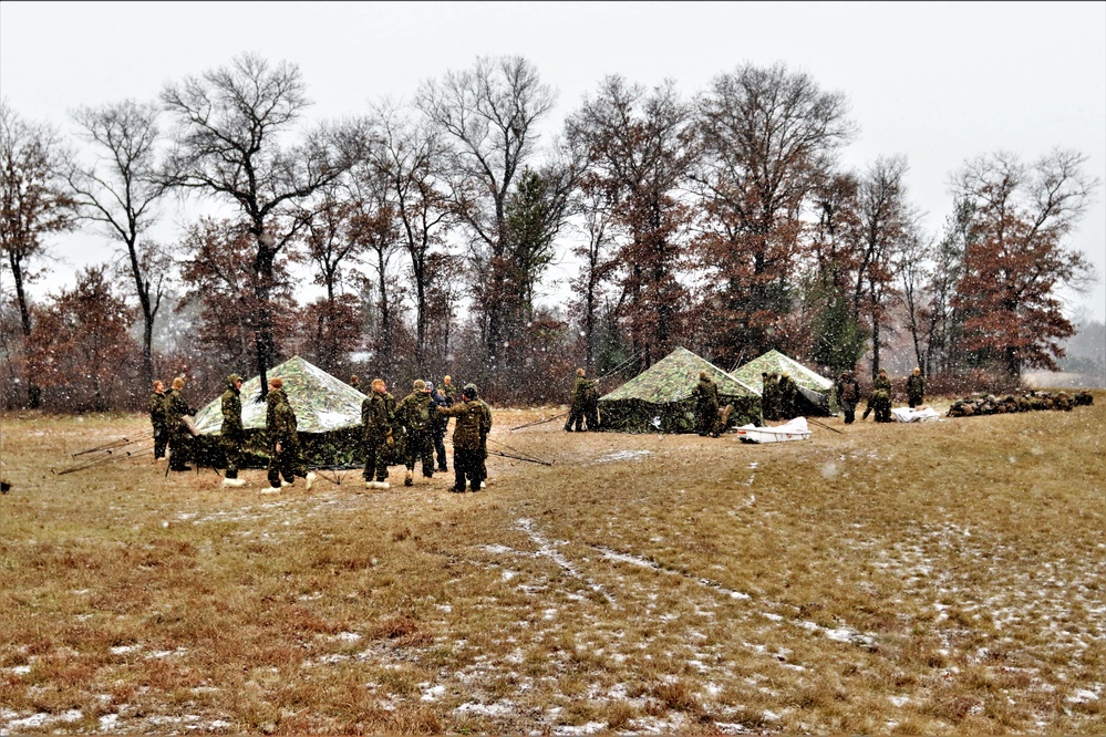 Marines practice tent building during Cold-Weather Operations Course training at Fort McCoy