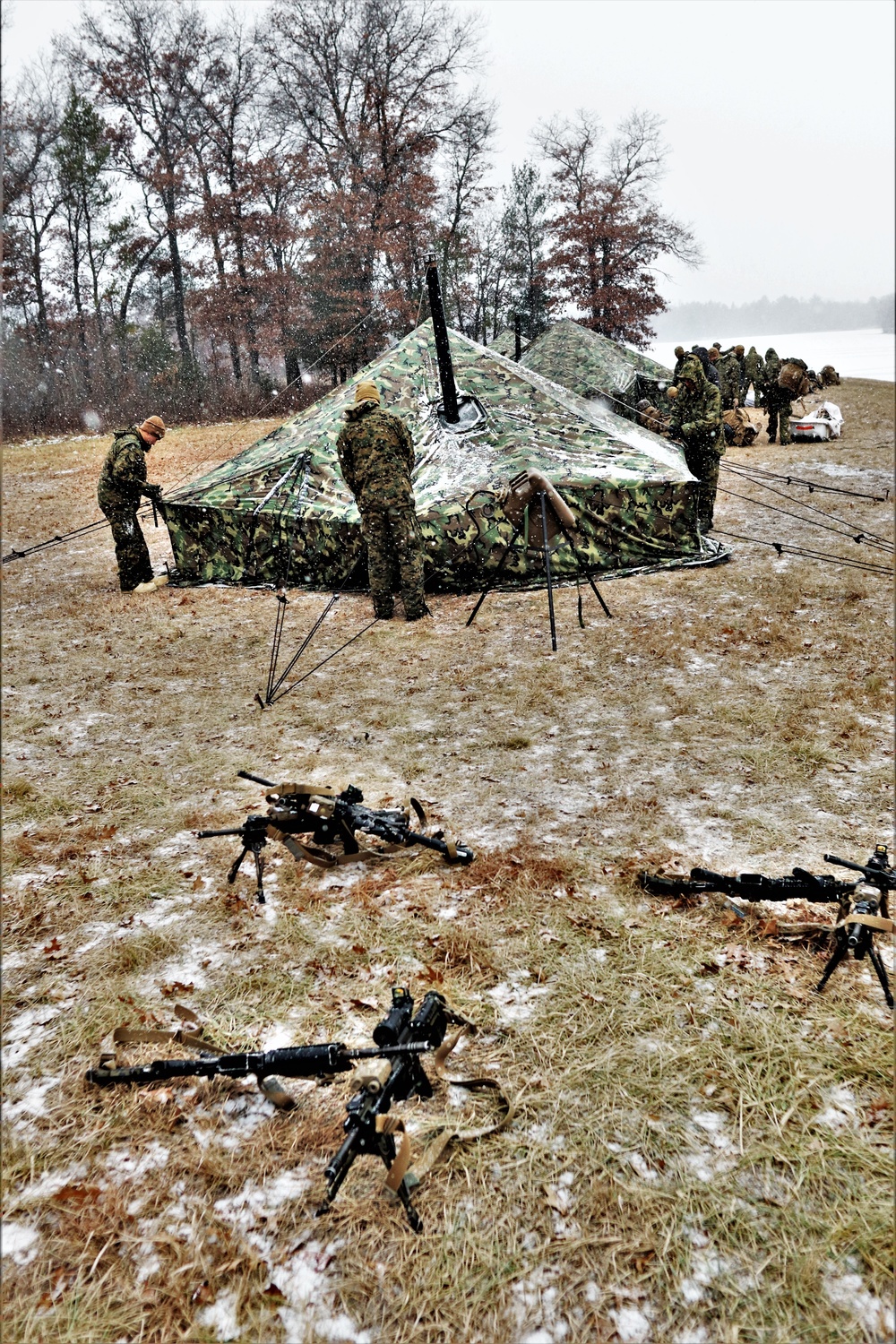 Marines practice tent building during Cold-Weather Operations Course training at Fort McCoy