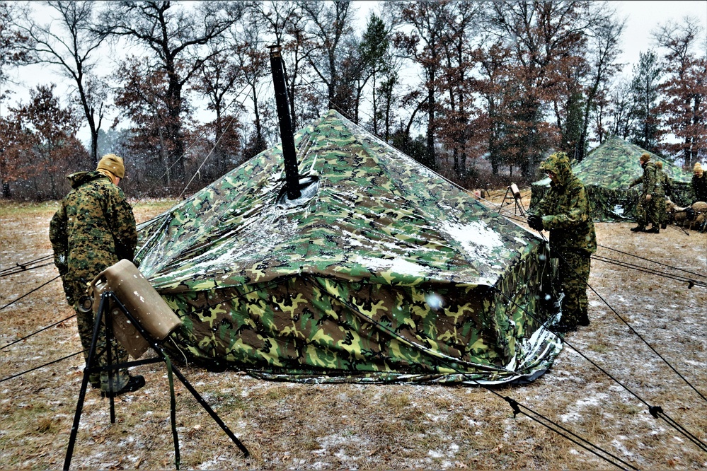 Marines practice tent building during Cold-Weather Operations Course training at Fort McCoy