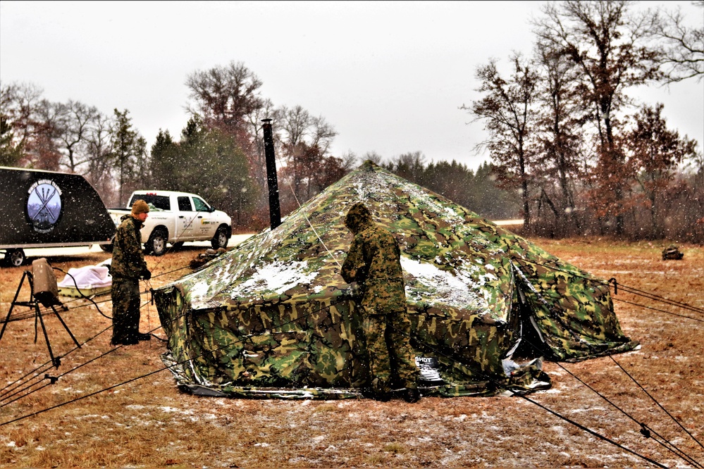 Marines practice tent building during Cold-Weather Operations Course training at Fort McCoy