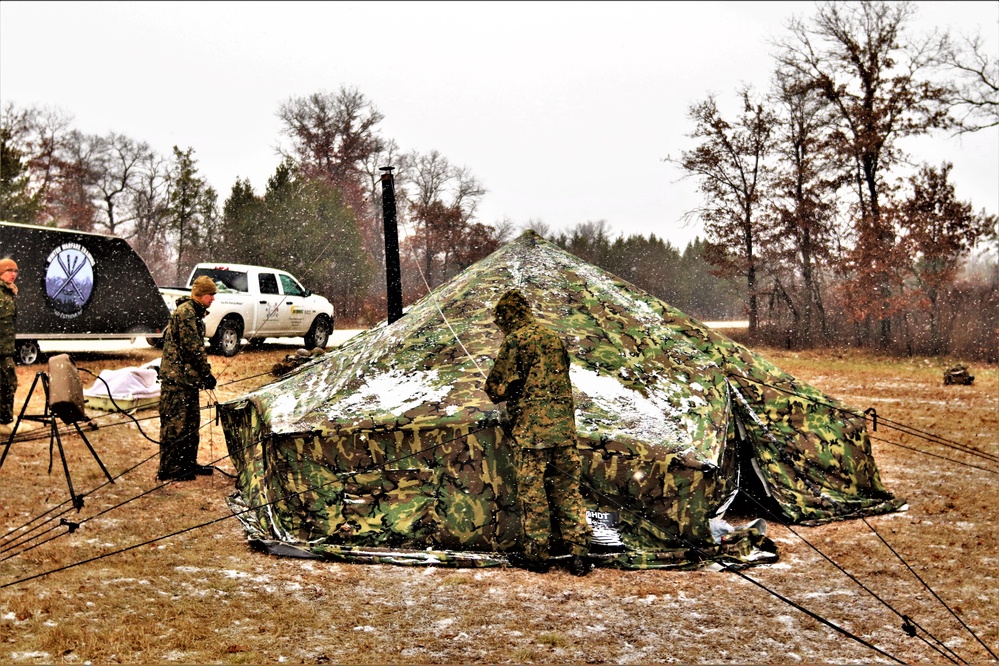 Marines practice tent building during Cold-Weather Operations Course training at Fort McCoy