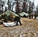 Marines practice tent building during Cold-Weather Operations Course training at Fort McCoy